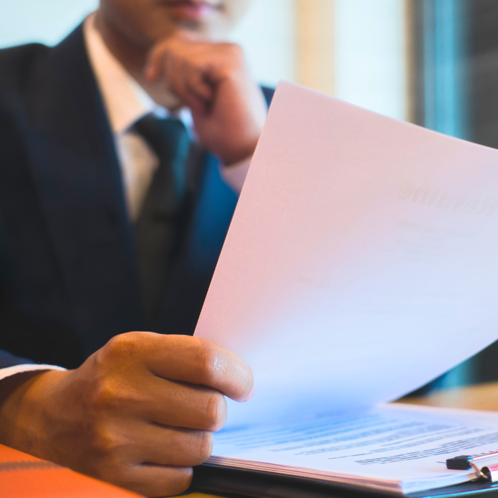 Landlord reviewing UK property compliance checklist with tenant documents